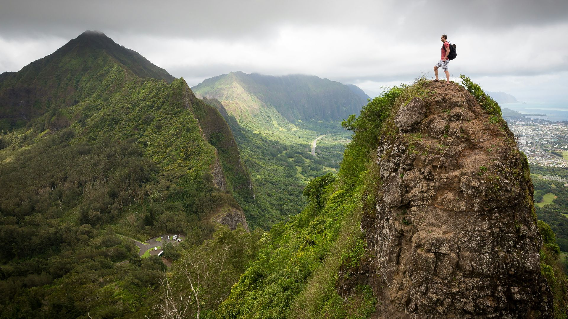 man on top of the mountain during daytime