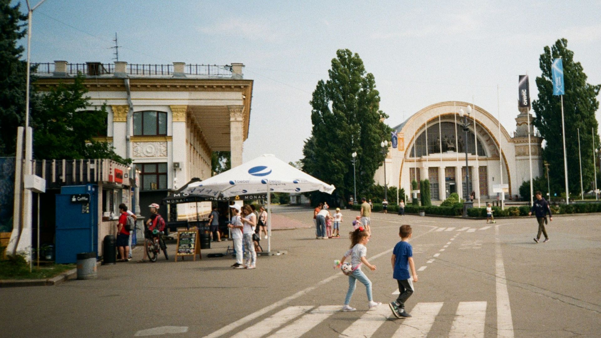 people walking in a plaza