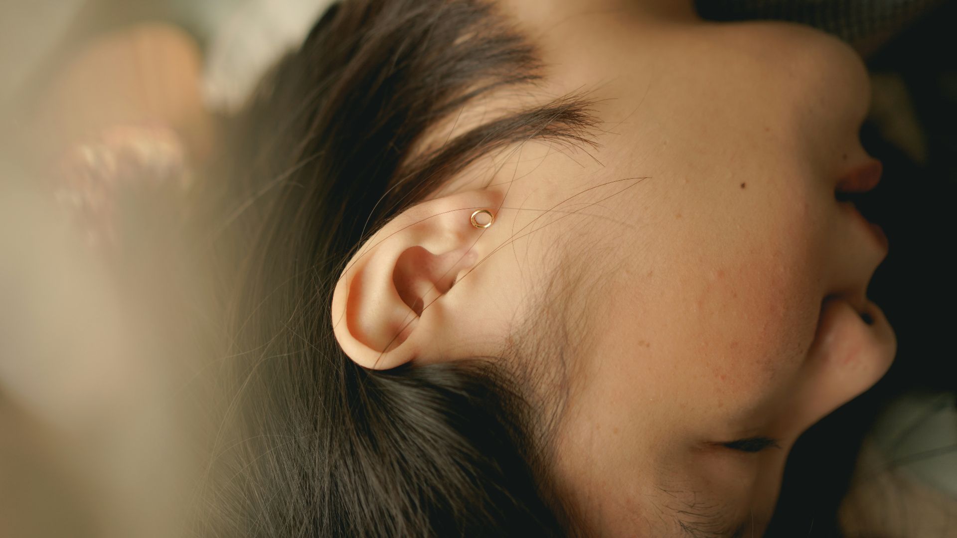 woman sleeping on white textile