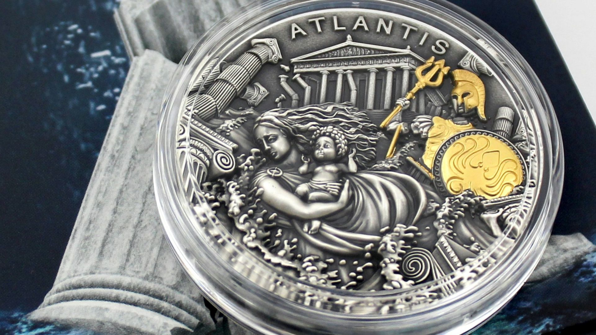 silver and black round coin