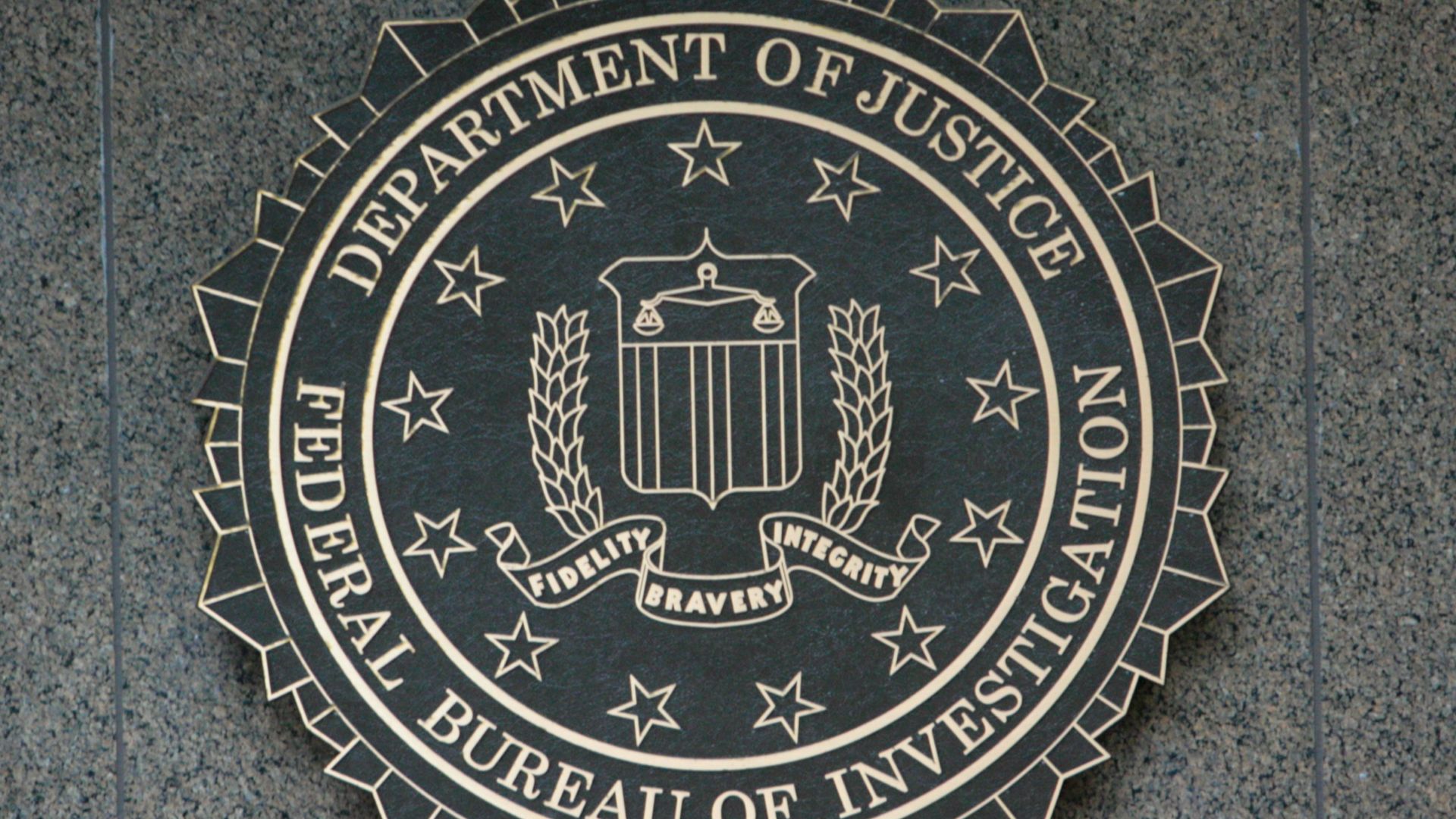 the seal of the department of justice on a wall