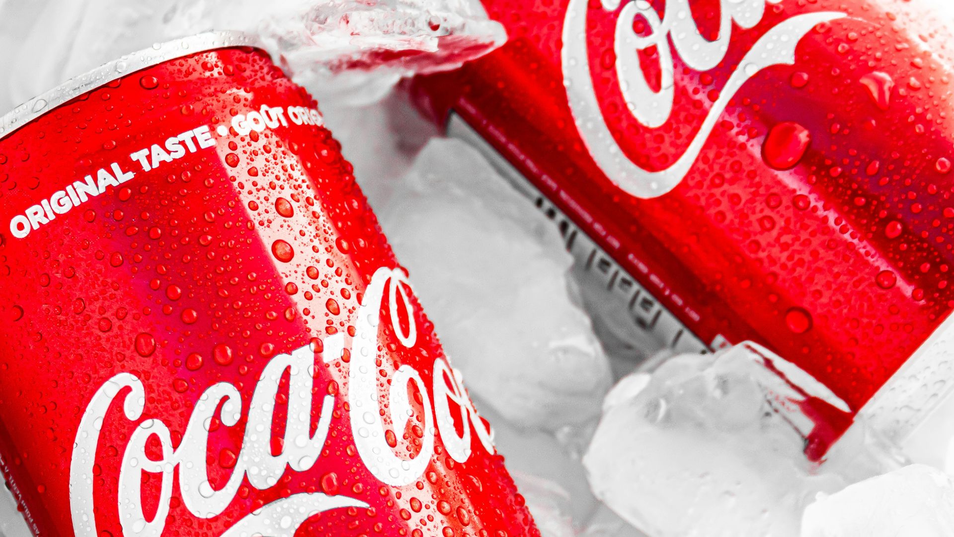 coca cola can on white plastic pack