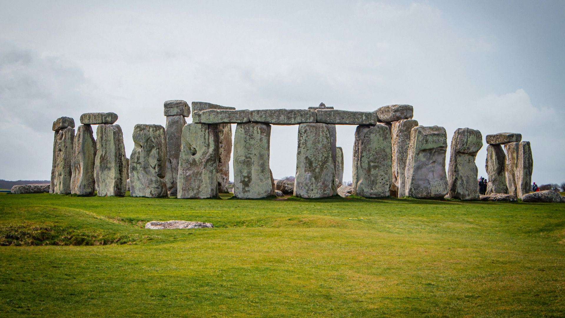 a large stone structure in the middle of a field