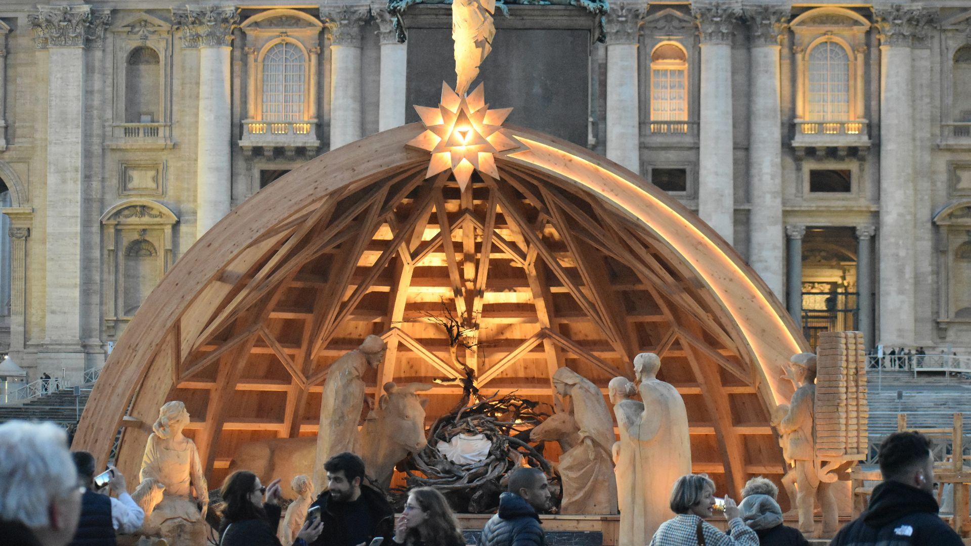A group of people standing in front of a building