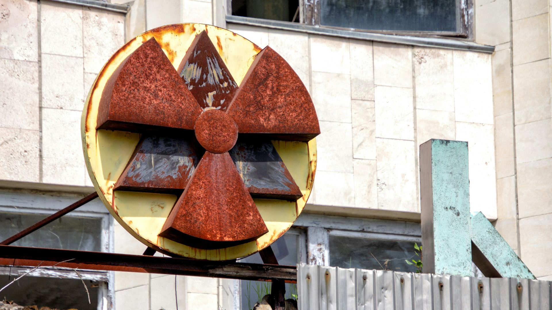 red and yellow radioactive signage at the building