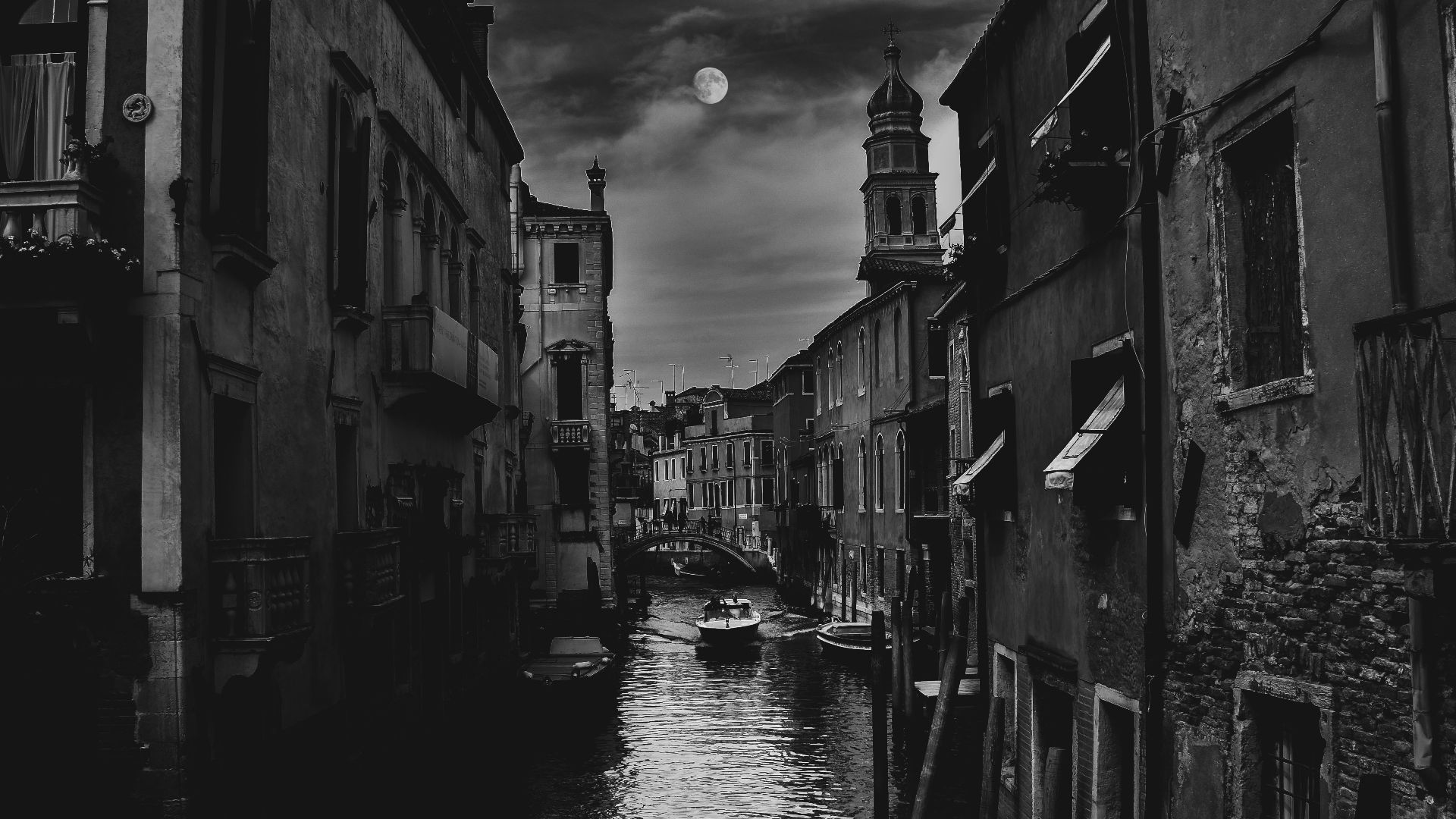 buildings and river with boat