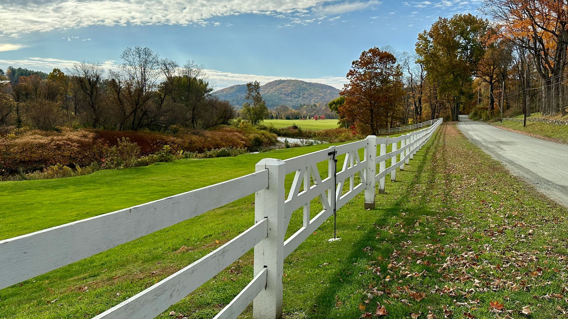 a white fence on a road