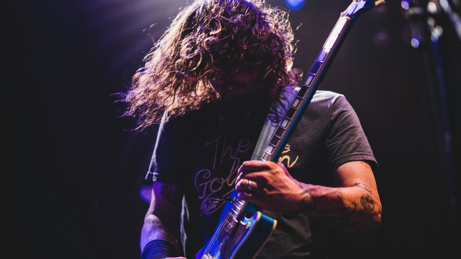 man playing electric guitar