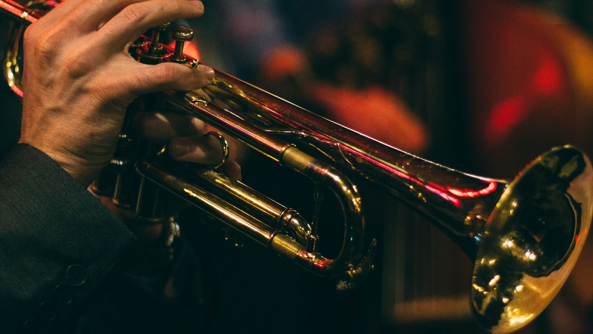 person playing trumpet during night time