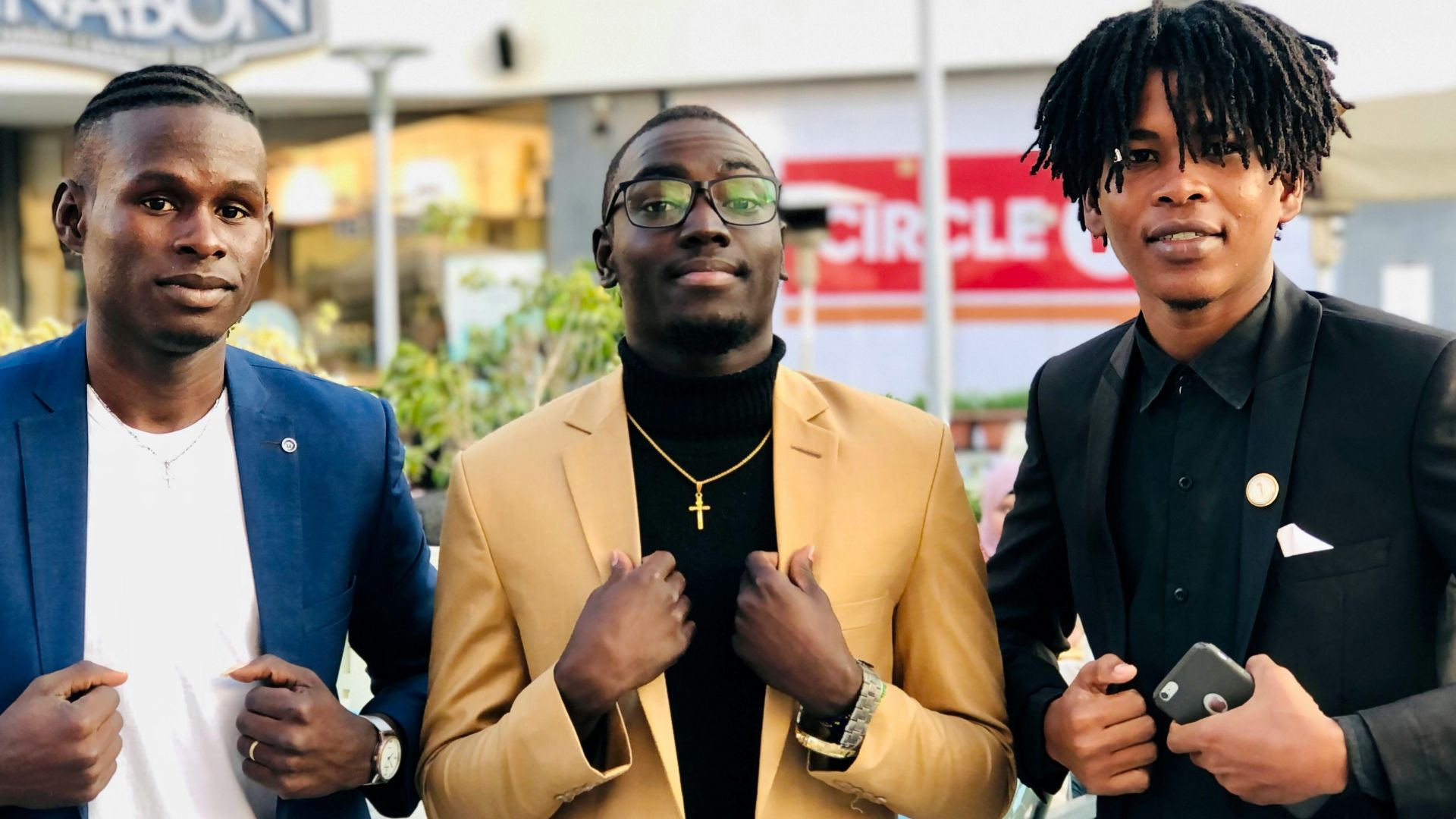 man in blue blazer holding microphone