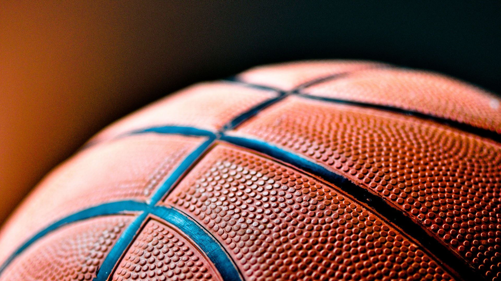 brown and black basketball ball