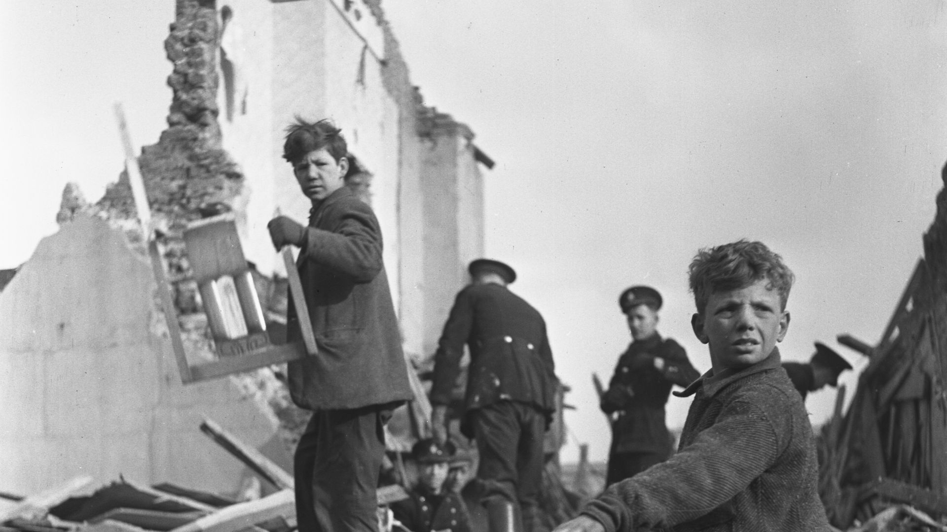 People and wreckage of buildings after a bombing raid of London during World War II