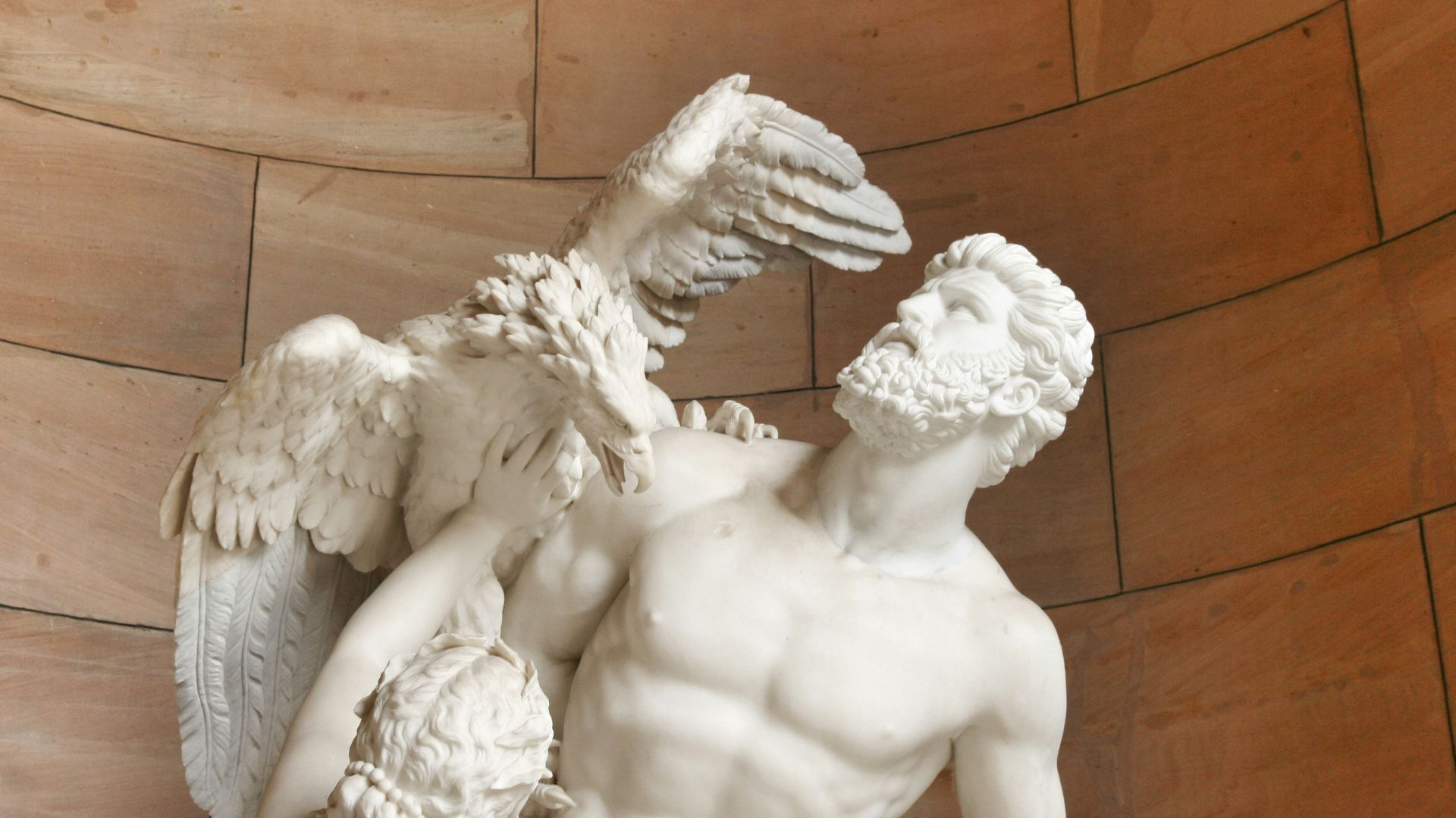 angel statue on brown wooden floor