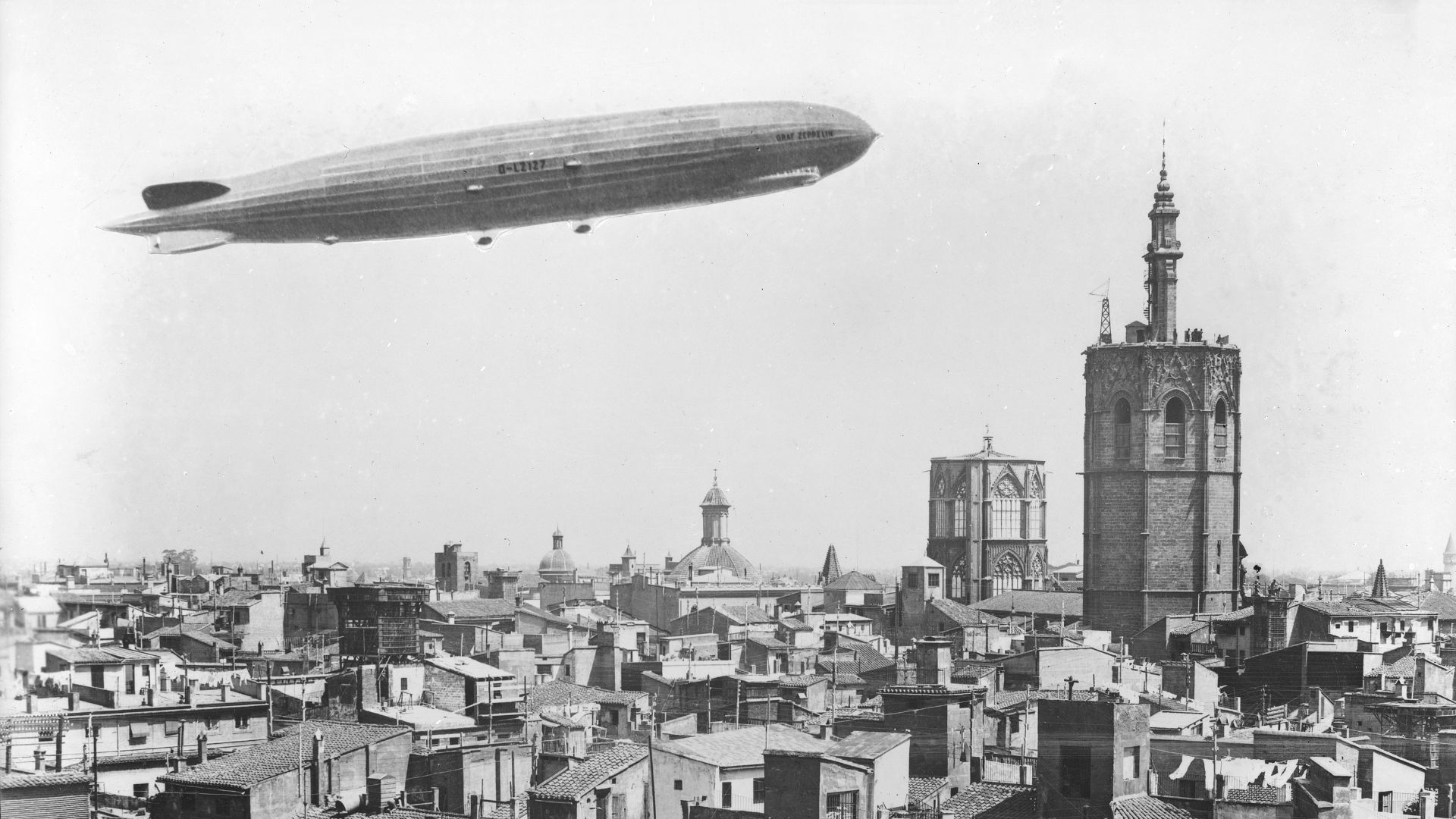 grayscale photo of city buildings