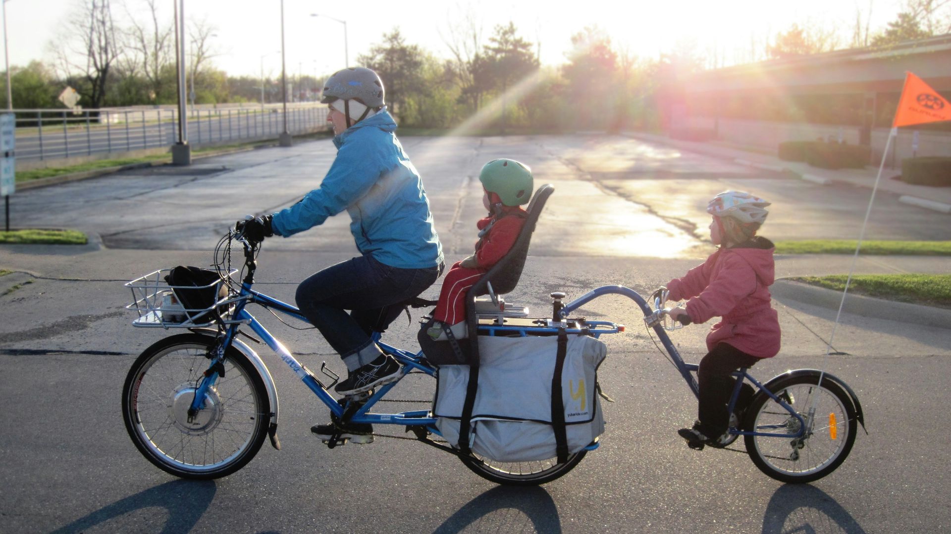 2 men riding on bicycle during daytime