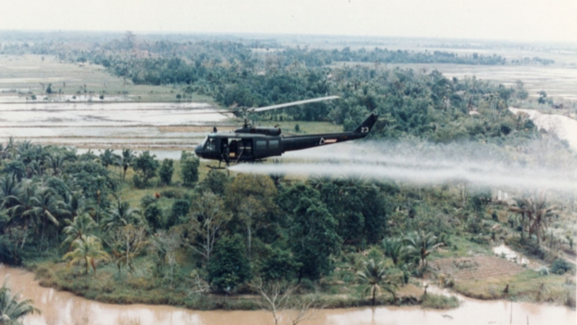File:US-Huey-helicopter-spraying-Agent-Orange-in-Vietnam.jpg