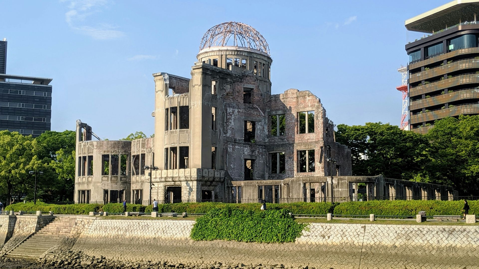 brown concrete building near body of water during daytime