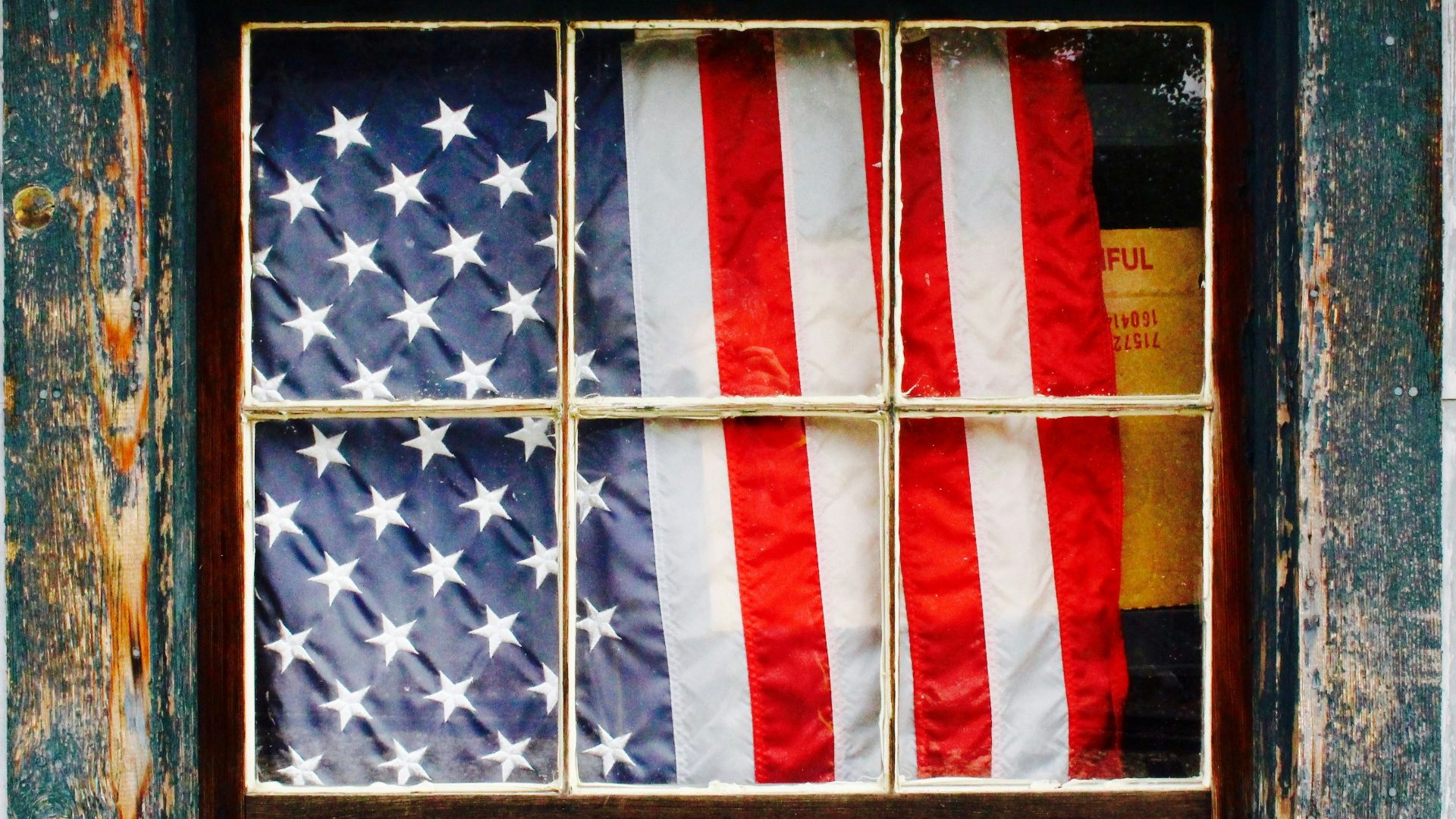 United States of America flag on window pane