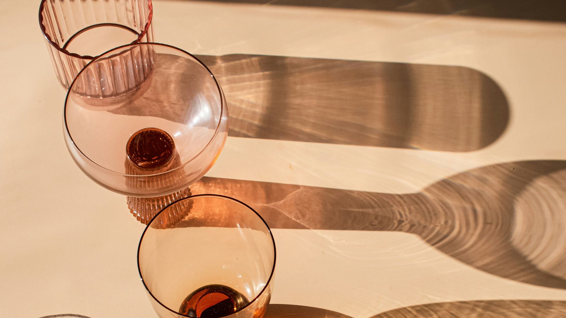 a number of wine glasses on a table