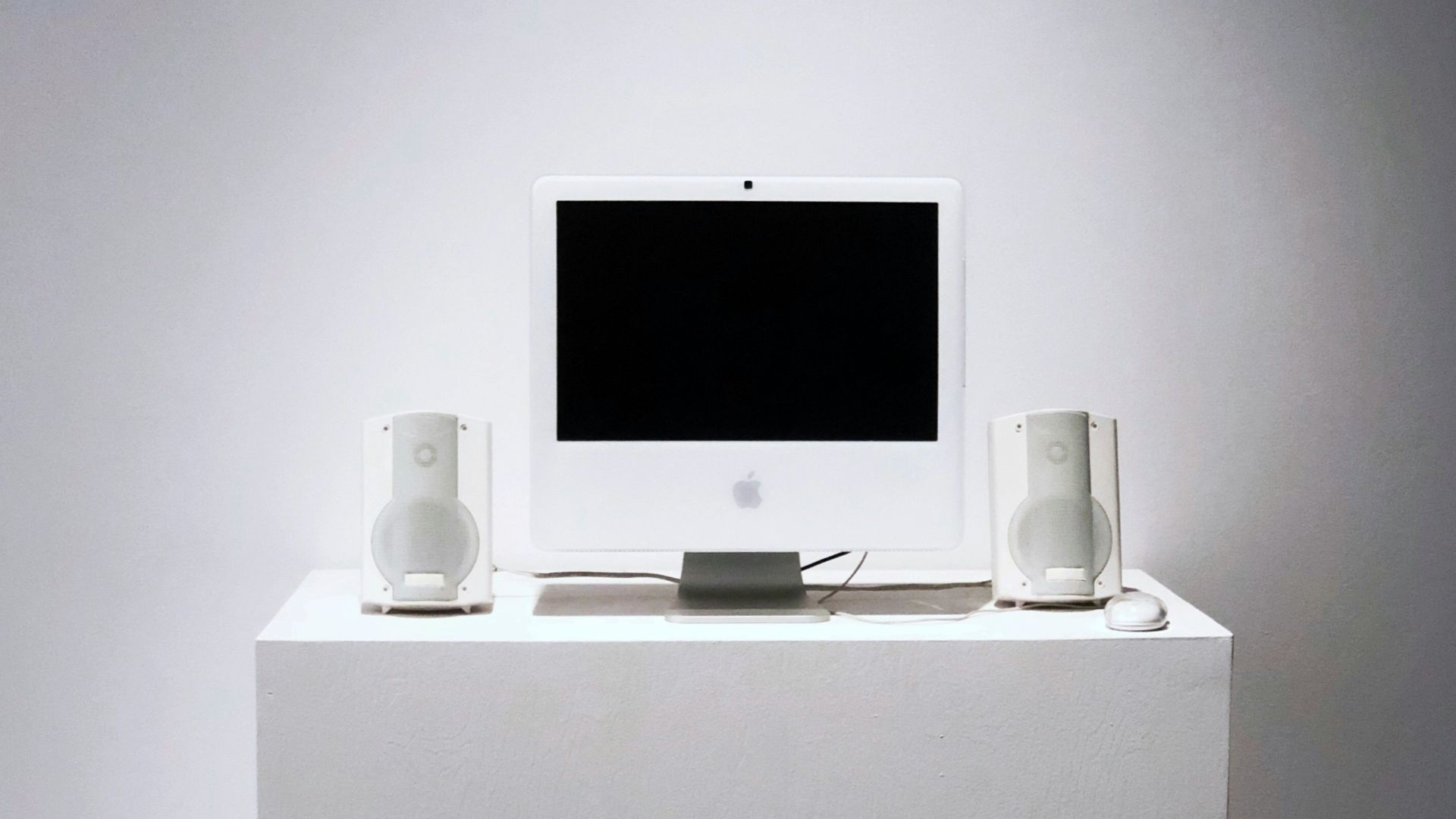Apple Studio Display monitor on white table