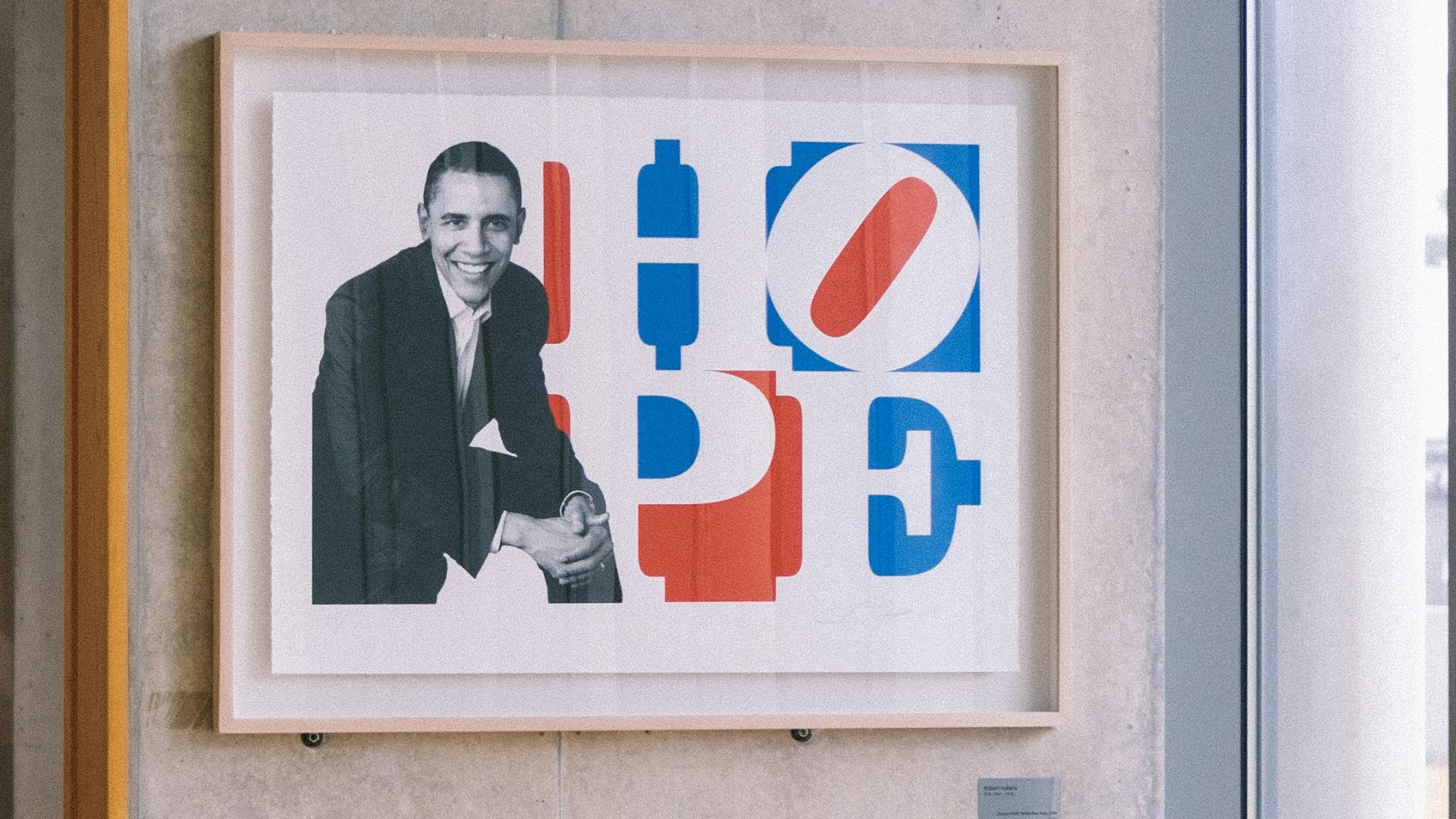 a picture of a man is hanging on the wall