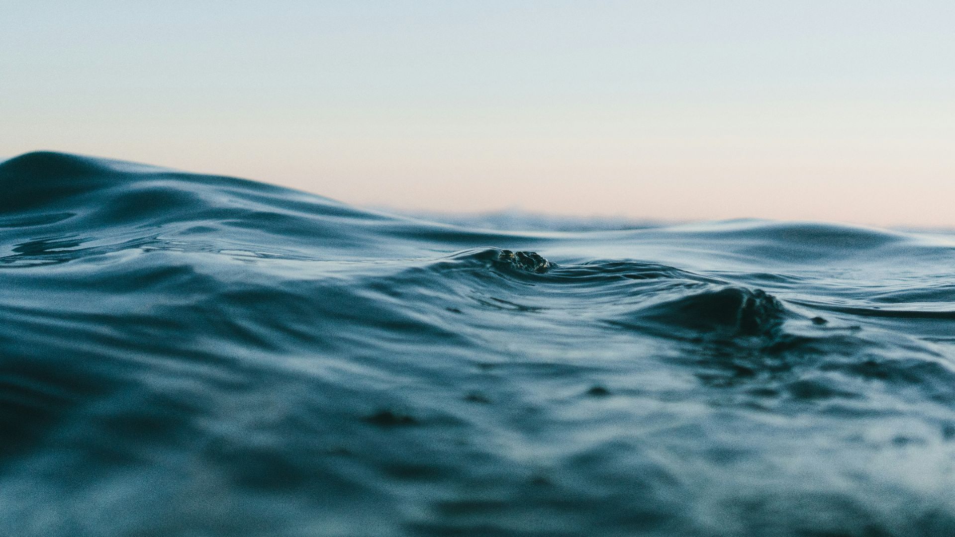 body of water under sky
