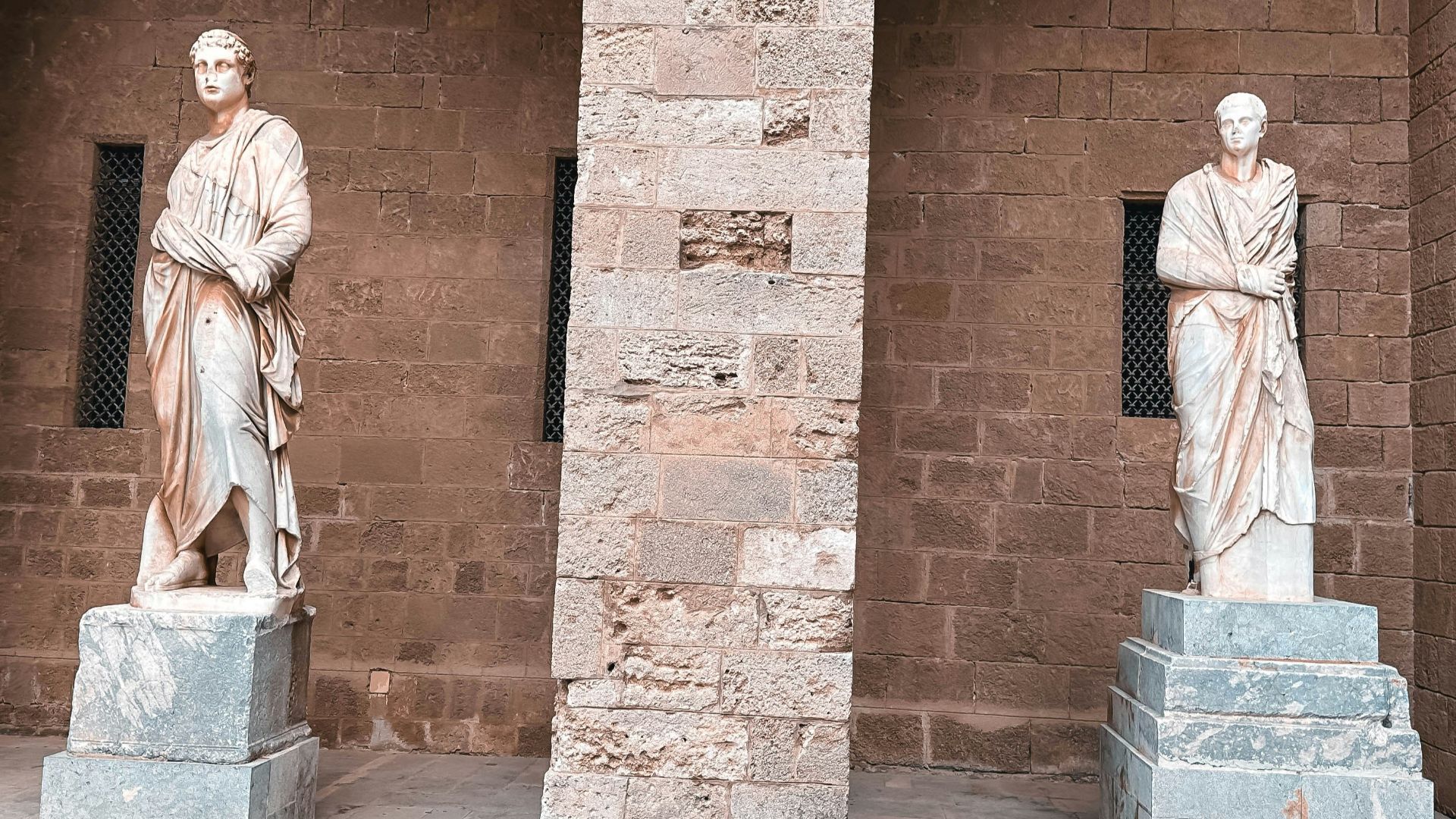 a couple of statues sitting next to each other