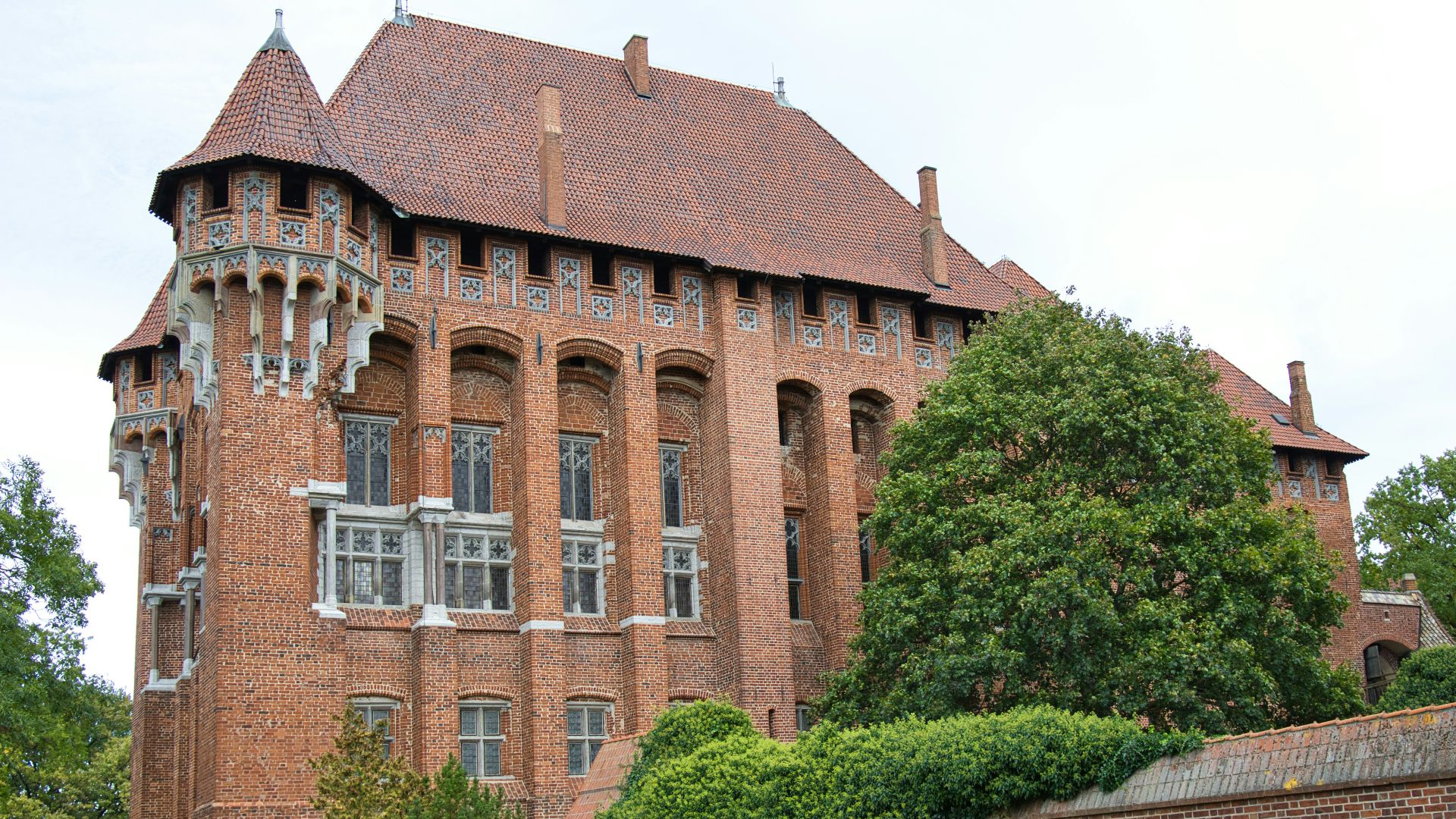 a large brick building with a tall tower
