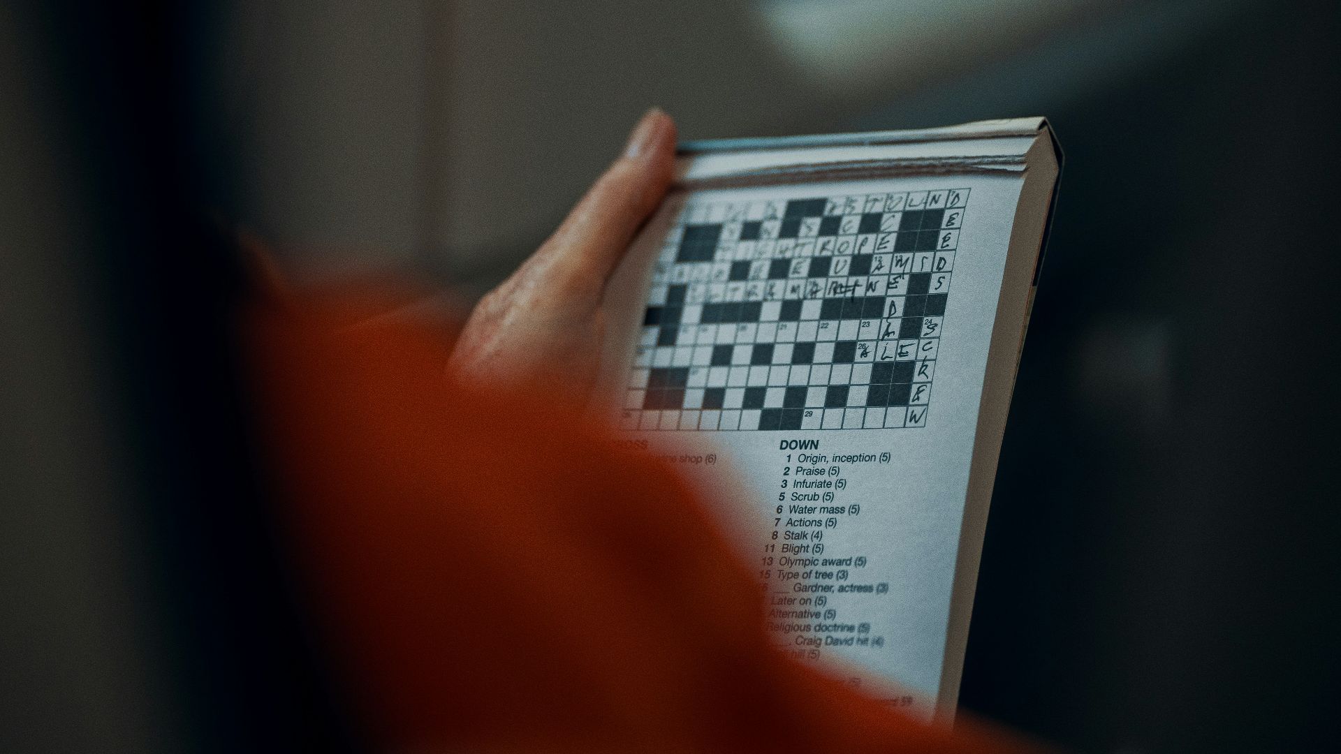 person holding white and black paper
