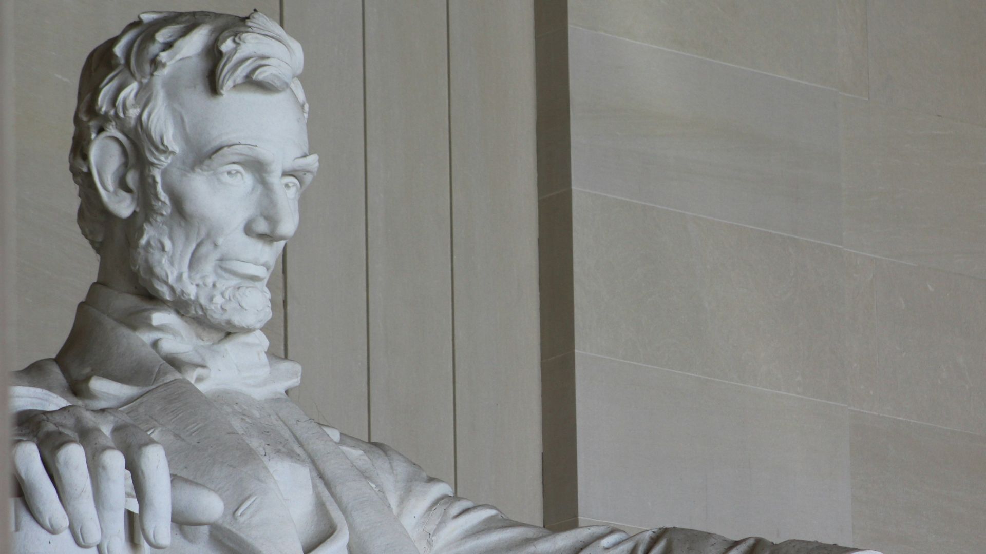 white concrete statue of man