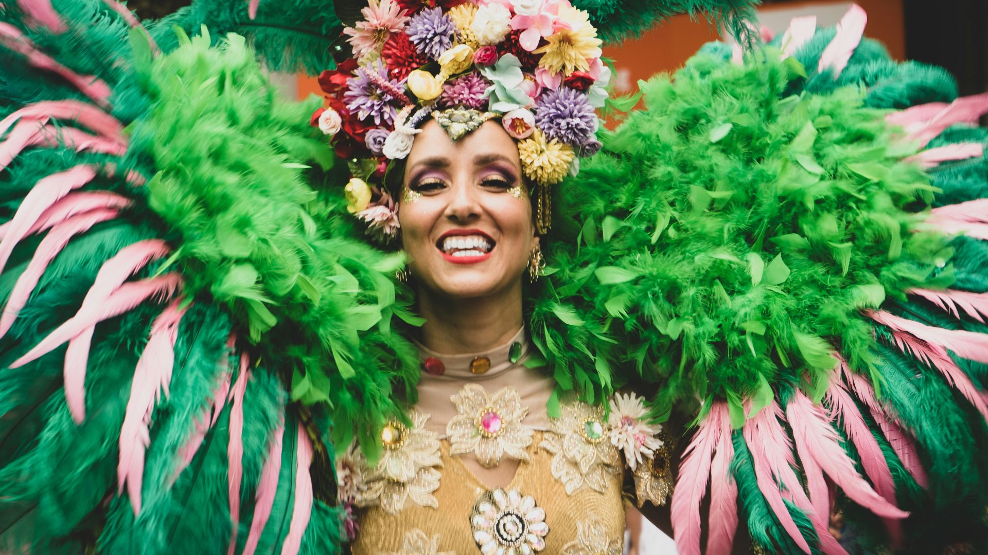 a woman in a green and pink costume