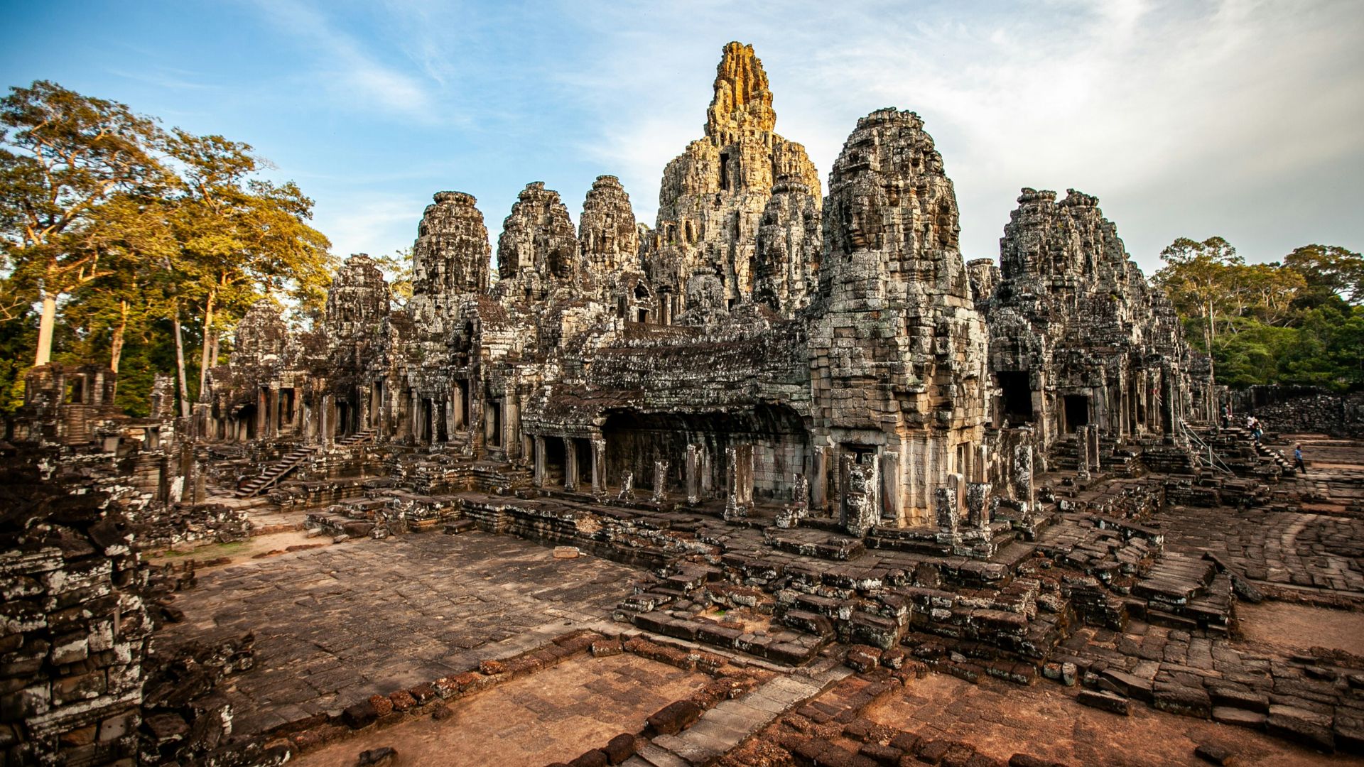 a large group of stone buildings surrounded by trees