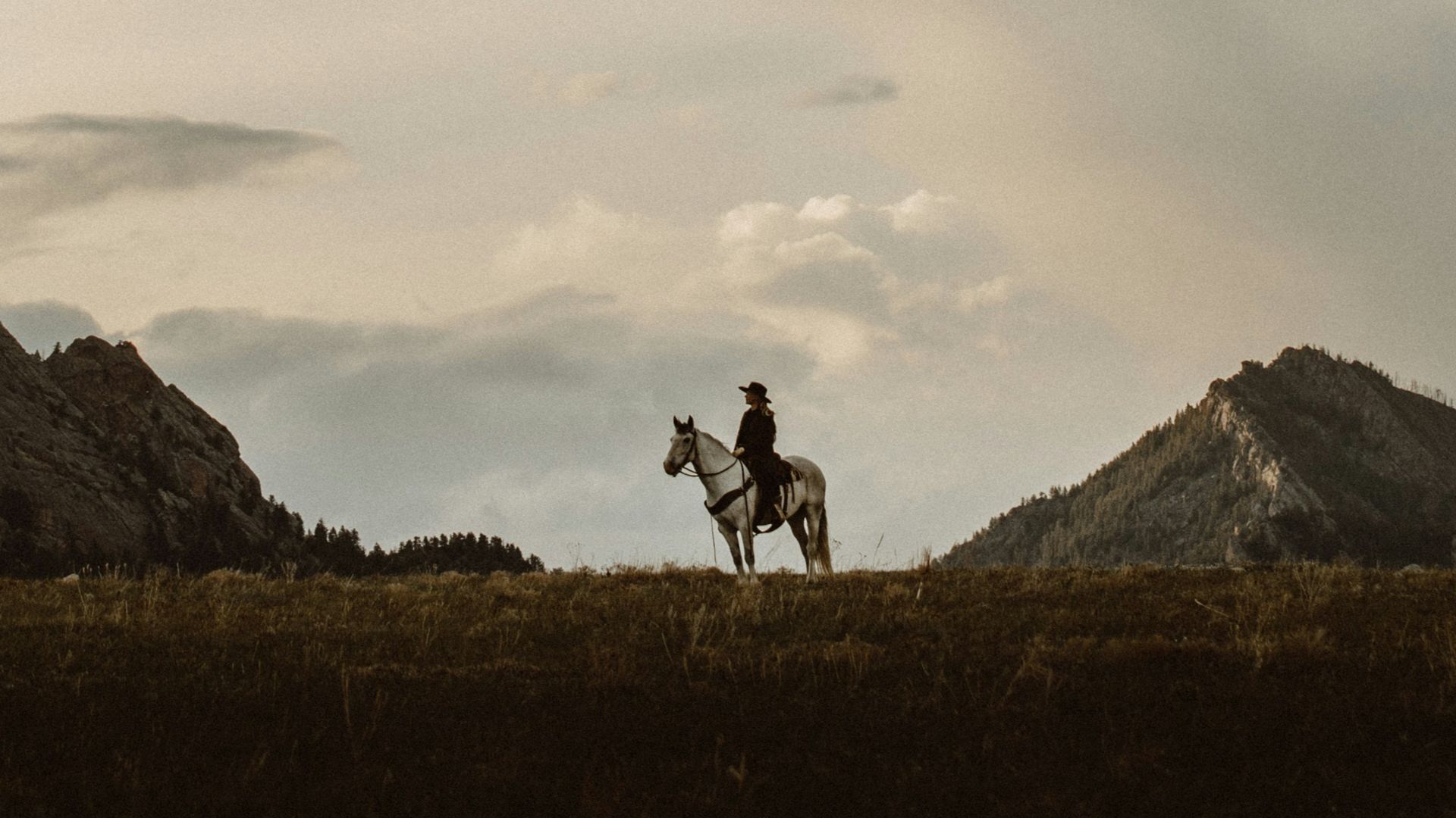 2 men walking on green grass field during daytime