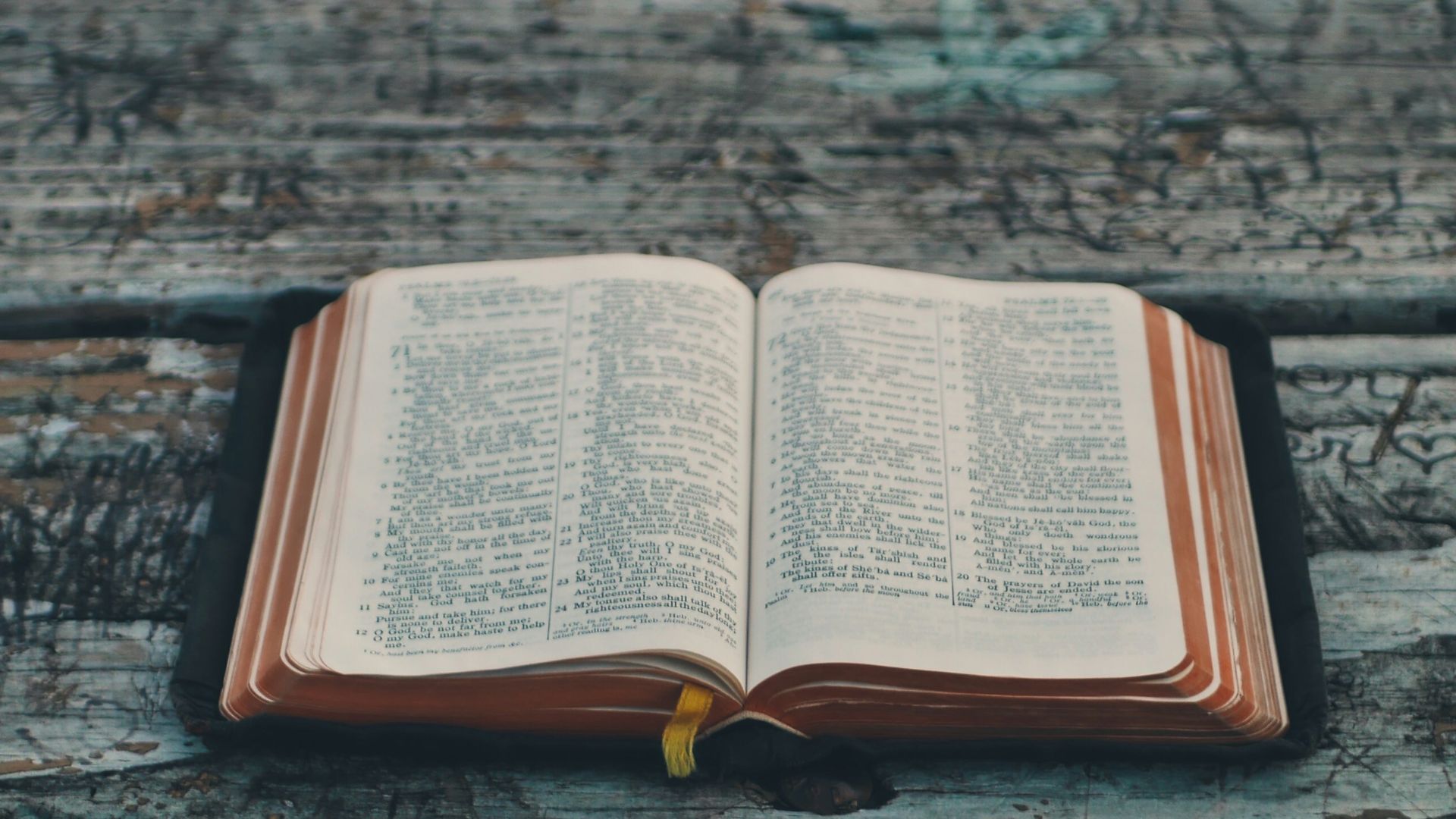 black book on gray wooden table