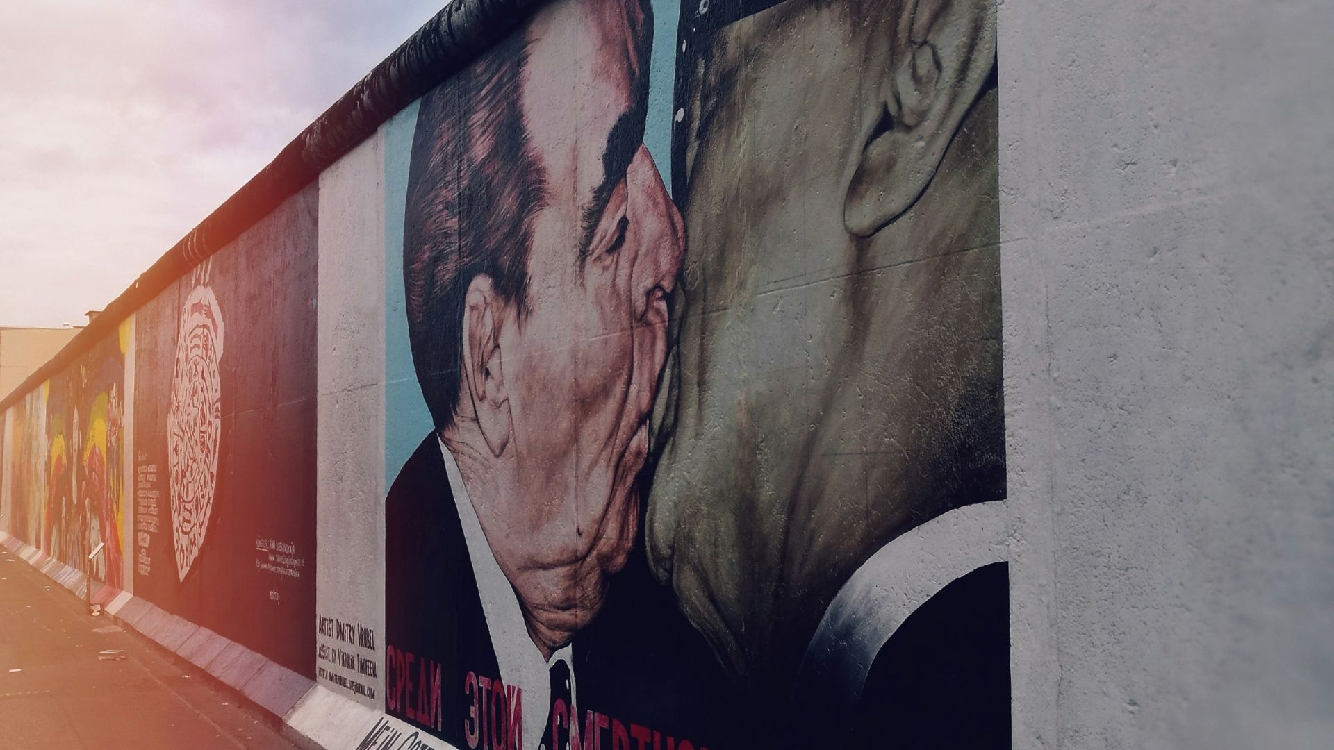 man in black suit jacket and woman in black dress wall art