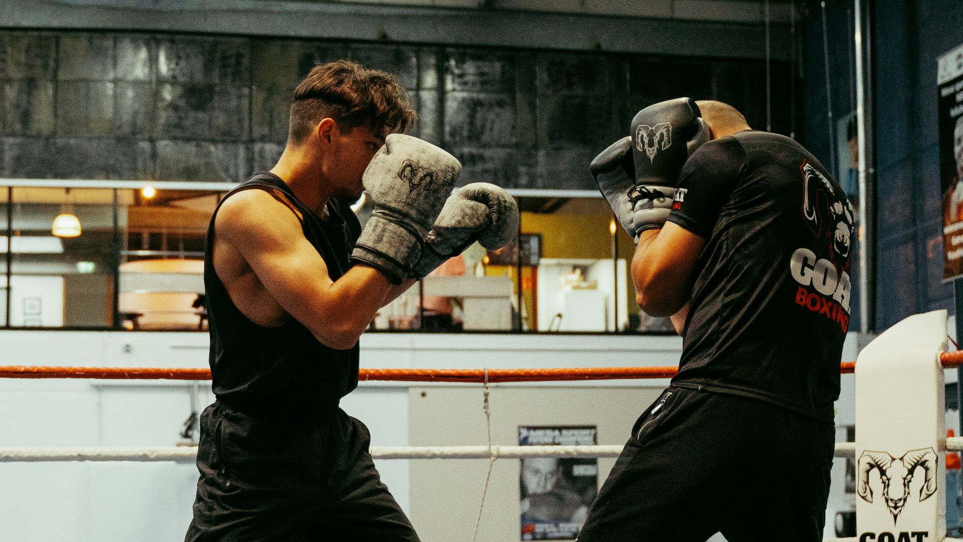 A couple of men standing in a boxing ring
