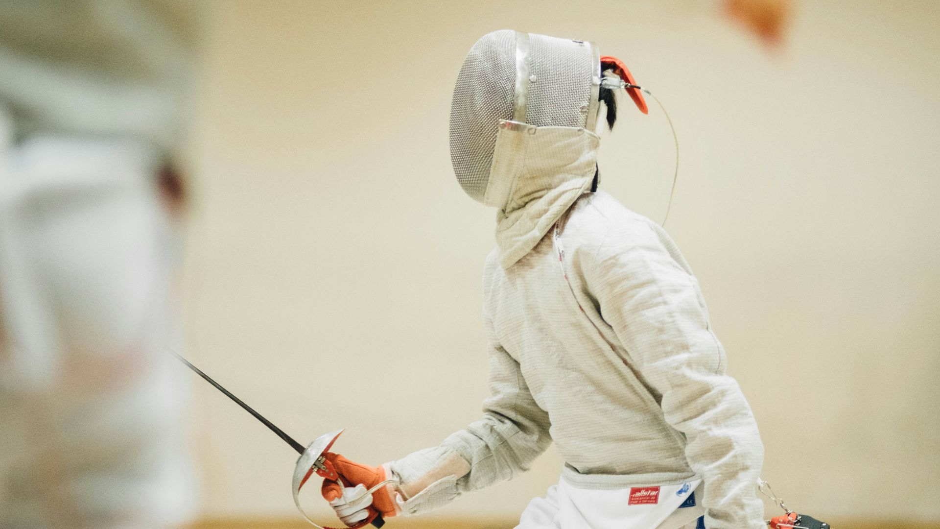 person holding black sabre dagger