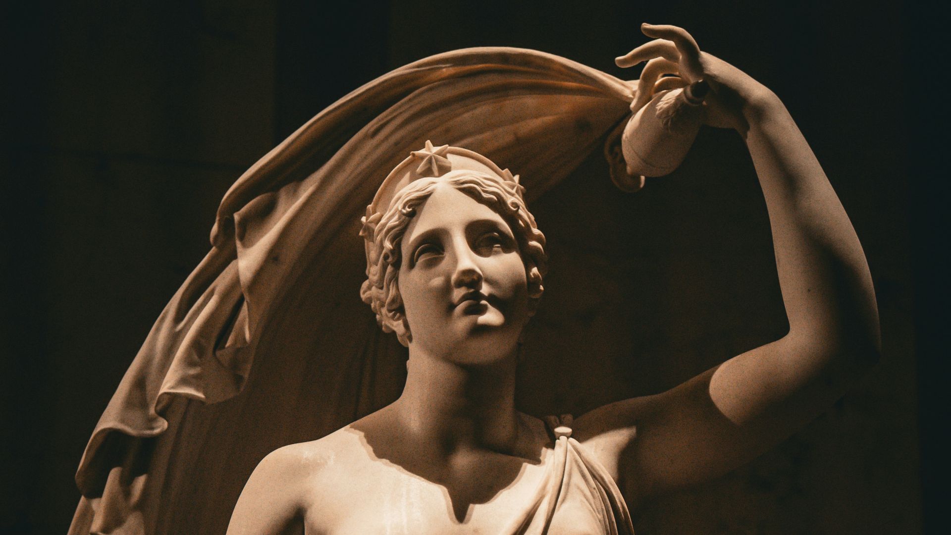 A statue of a woman holding a cloth