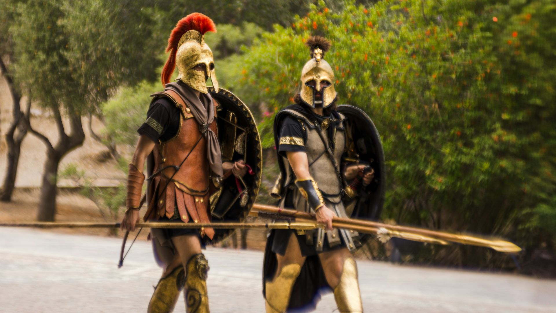 A couple of people that are standing in the street