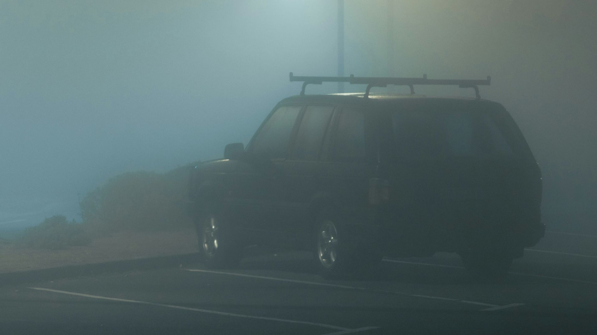 black suv on road during daytime