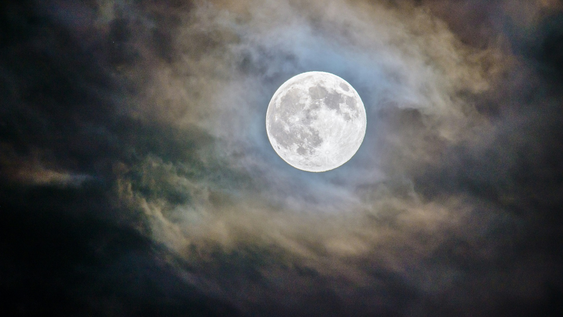full moon and gray clouds during nighttime