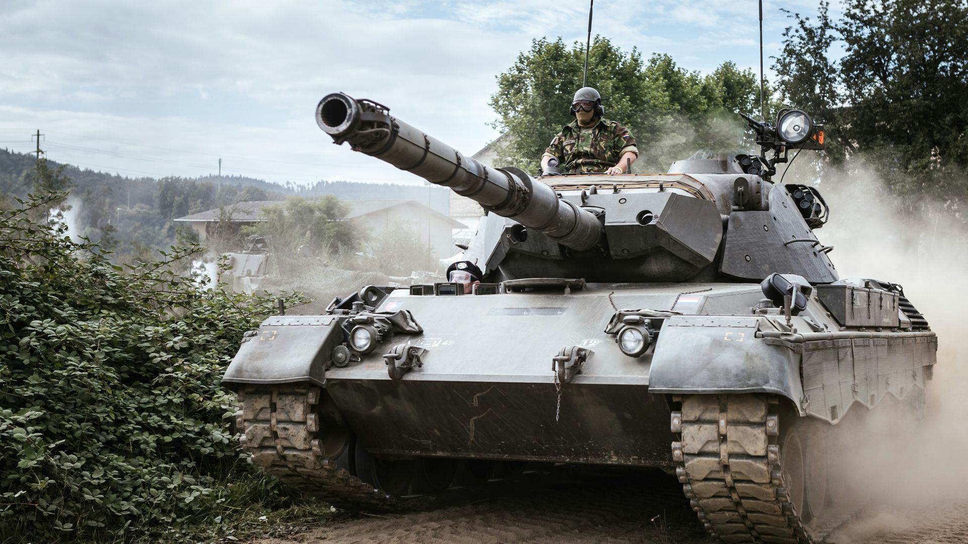 battle tank on green grass field during daytime