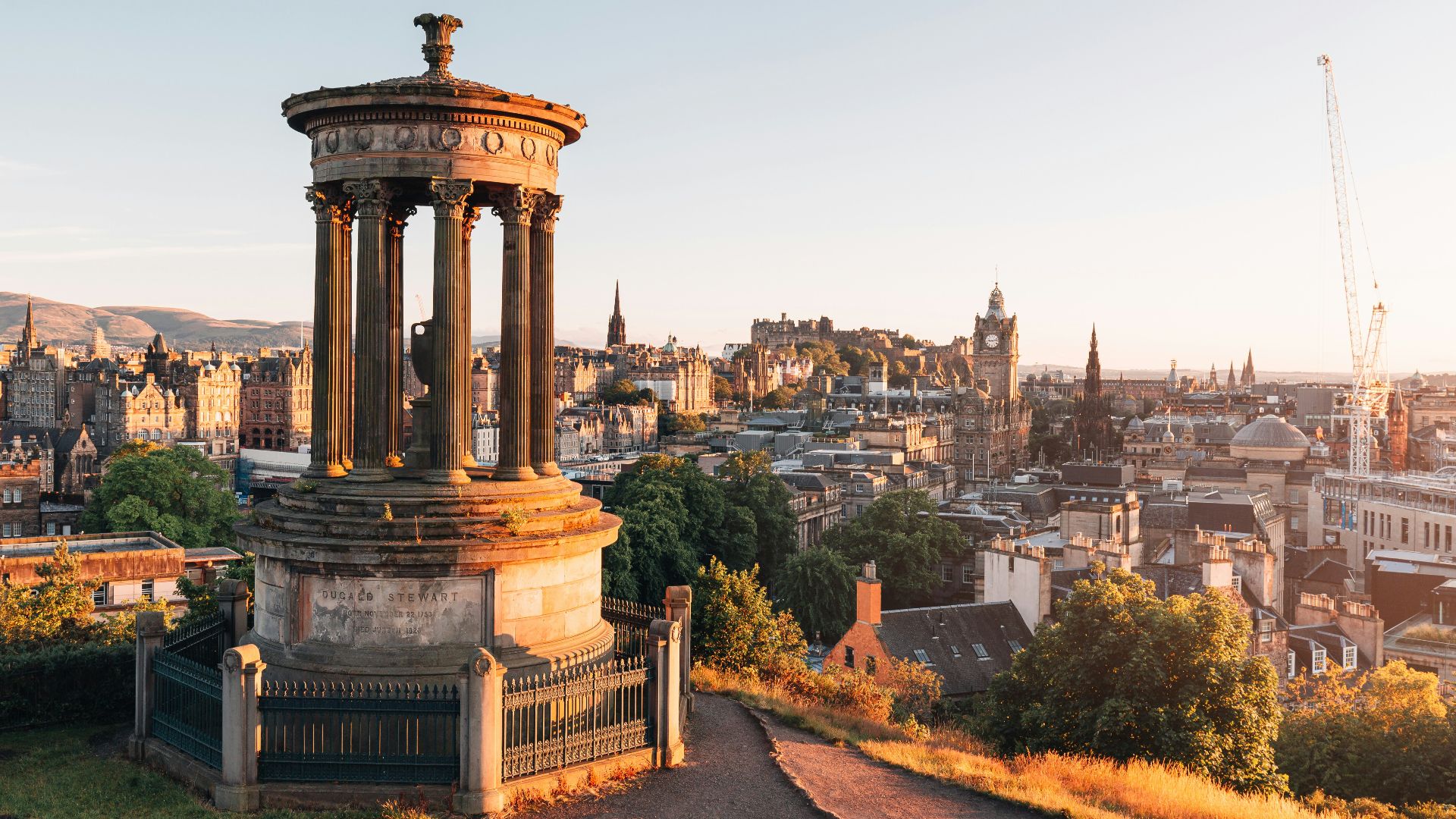 brown concrete building near trees during daytime