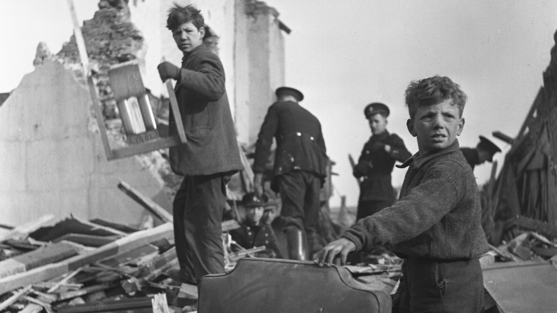 People and wreckage of buildings after a bombing raid of London during World War II
