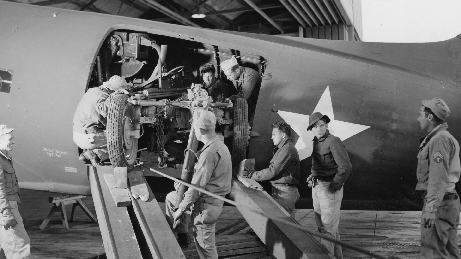 File:SC 364551 - Tricky procedure of unloading a 40mm Bofors from C-47 transport plane at Garbutt Field, Townsville, Queensland, Australia, at its most critical stage. (52107133054).jpg