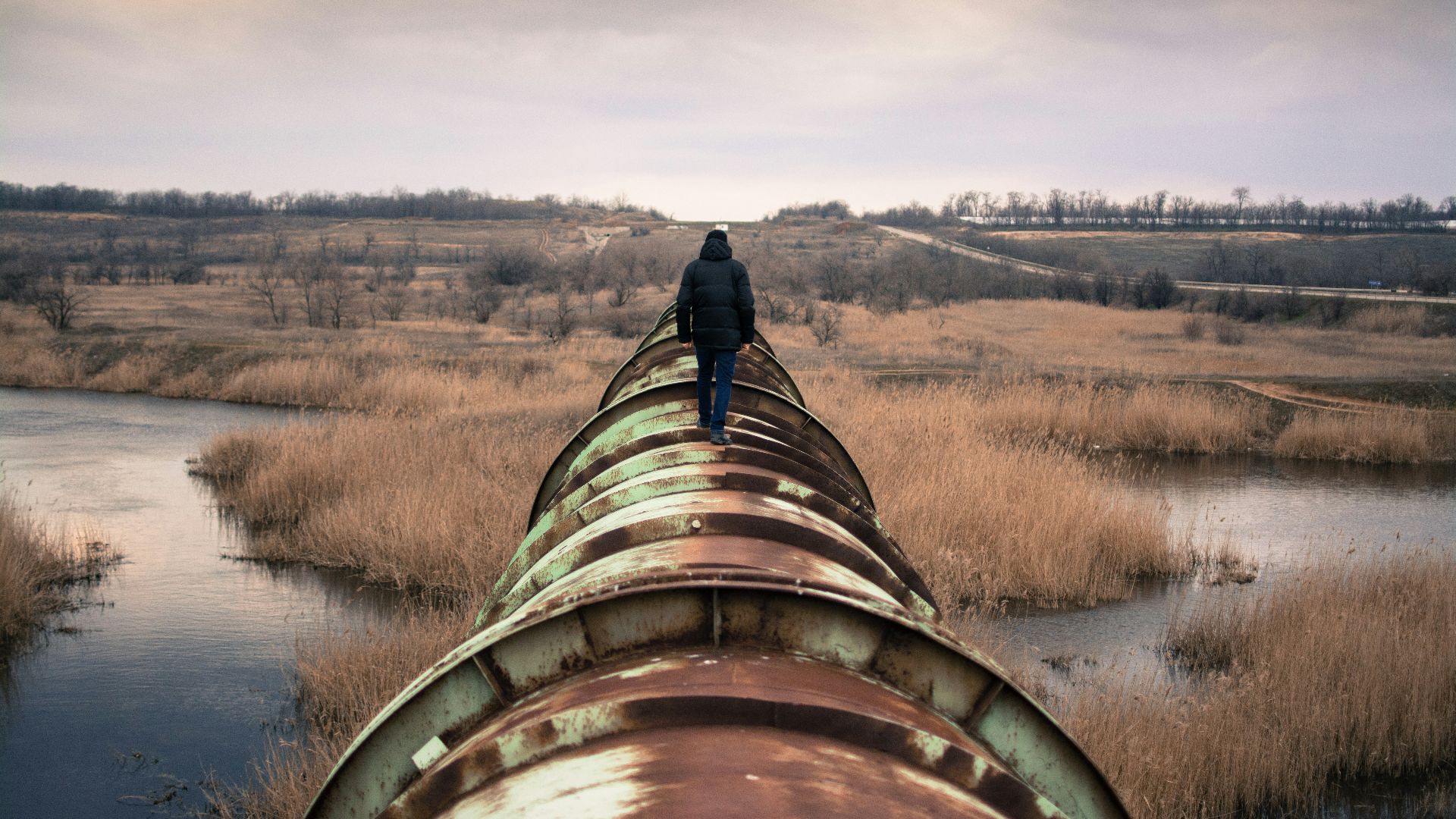 person on top of brown steel frame