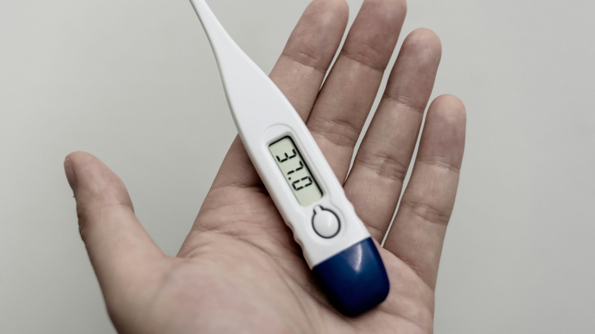 white and blue thermometer at 36 9