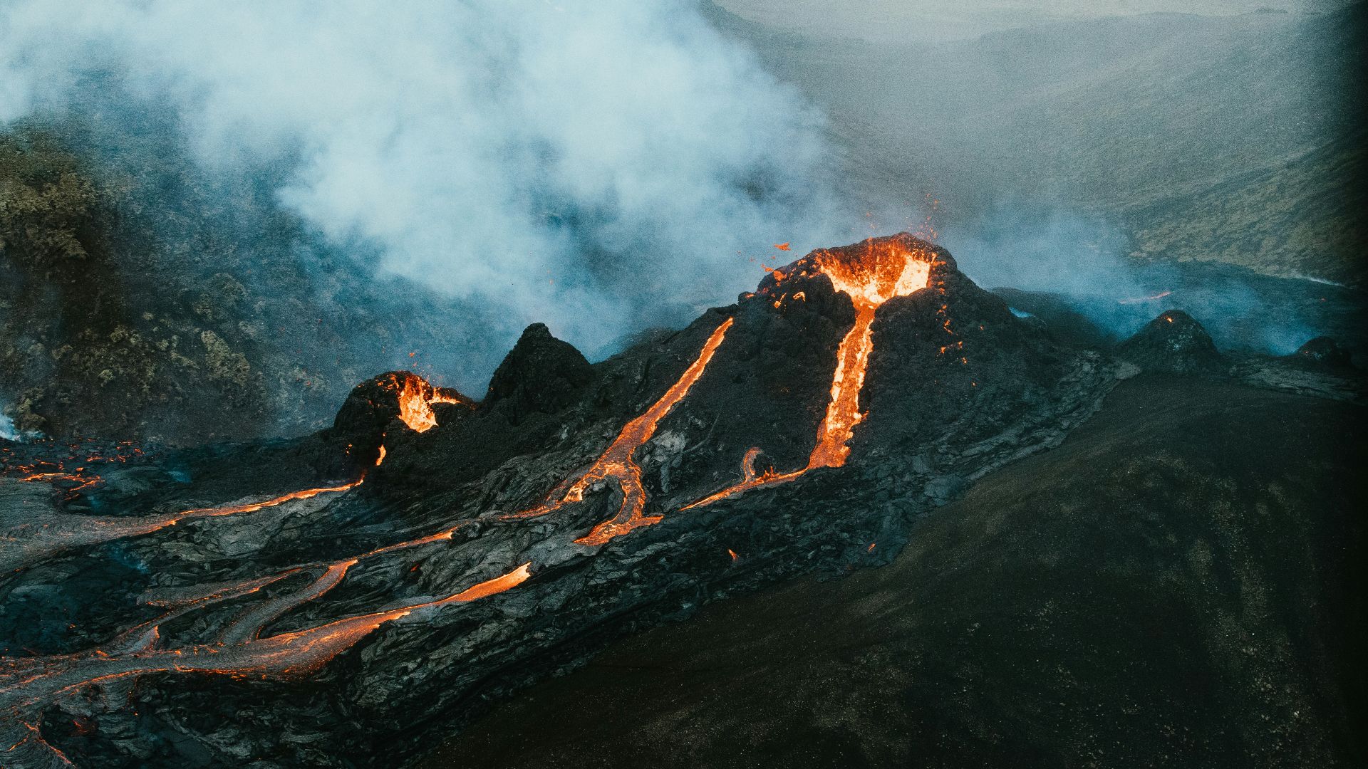 brown and black mountain with white clouds