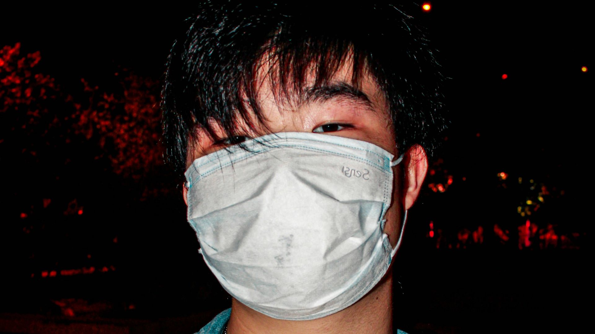 man in blue denim button up jacket with white face mask