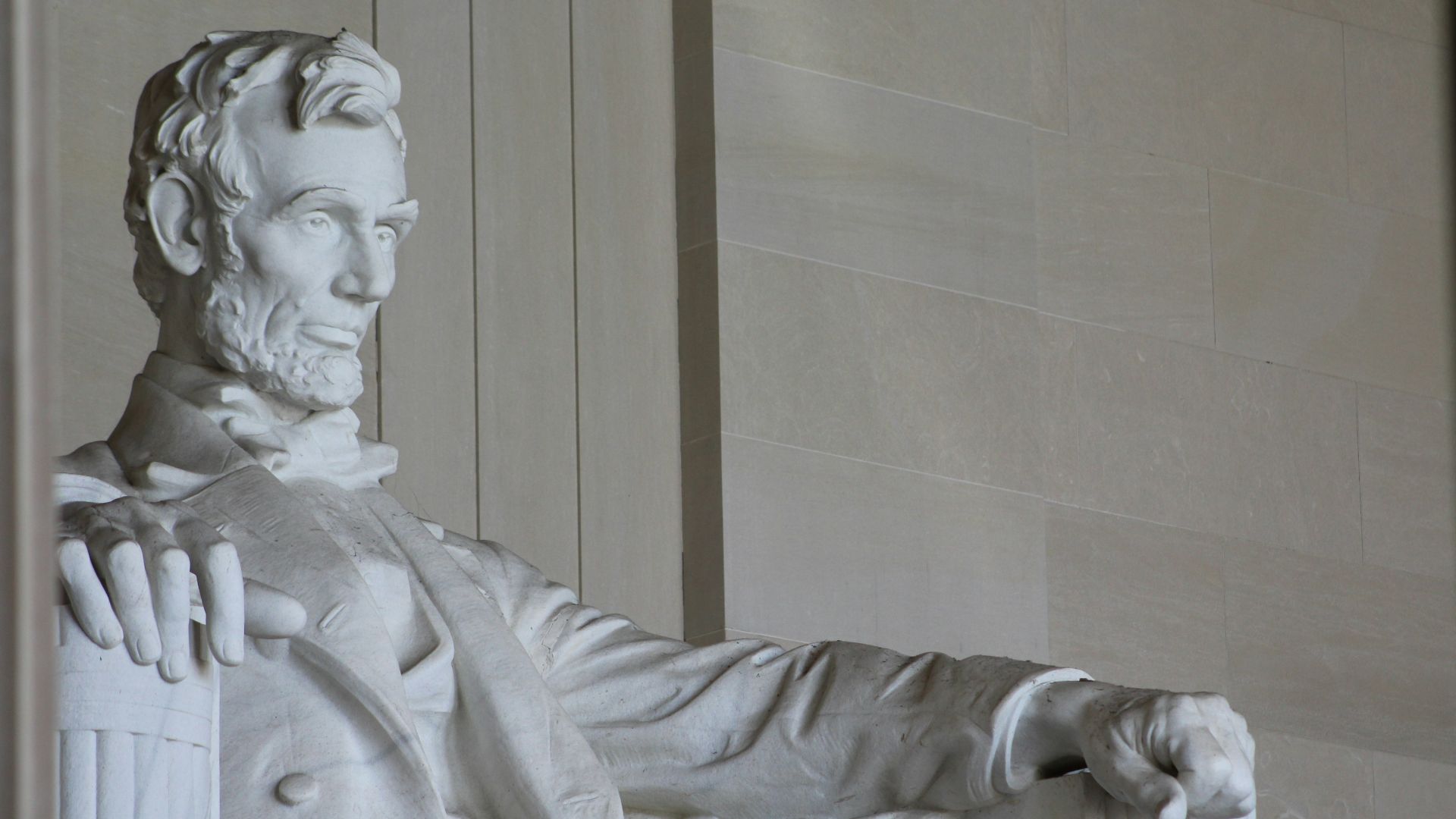 white concrete statue of man